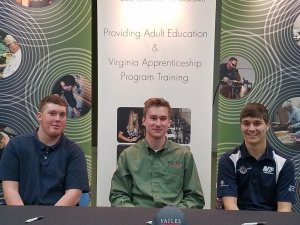 Apprentices at signing event
